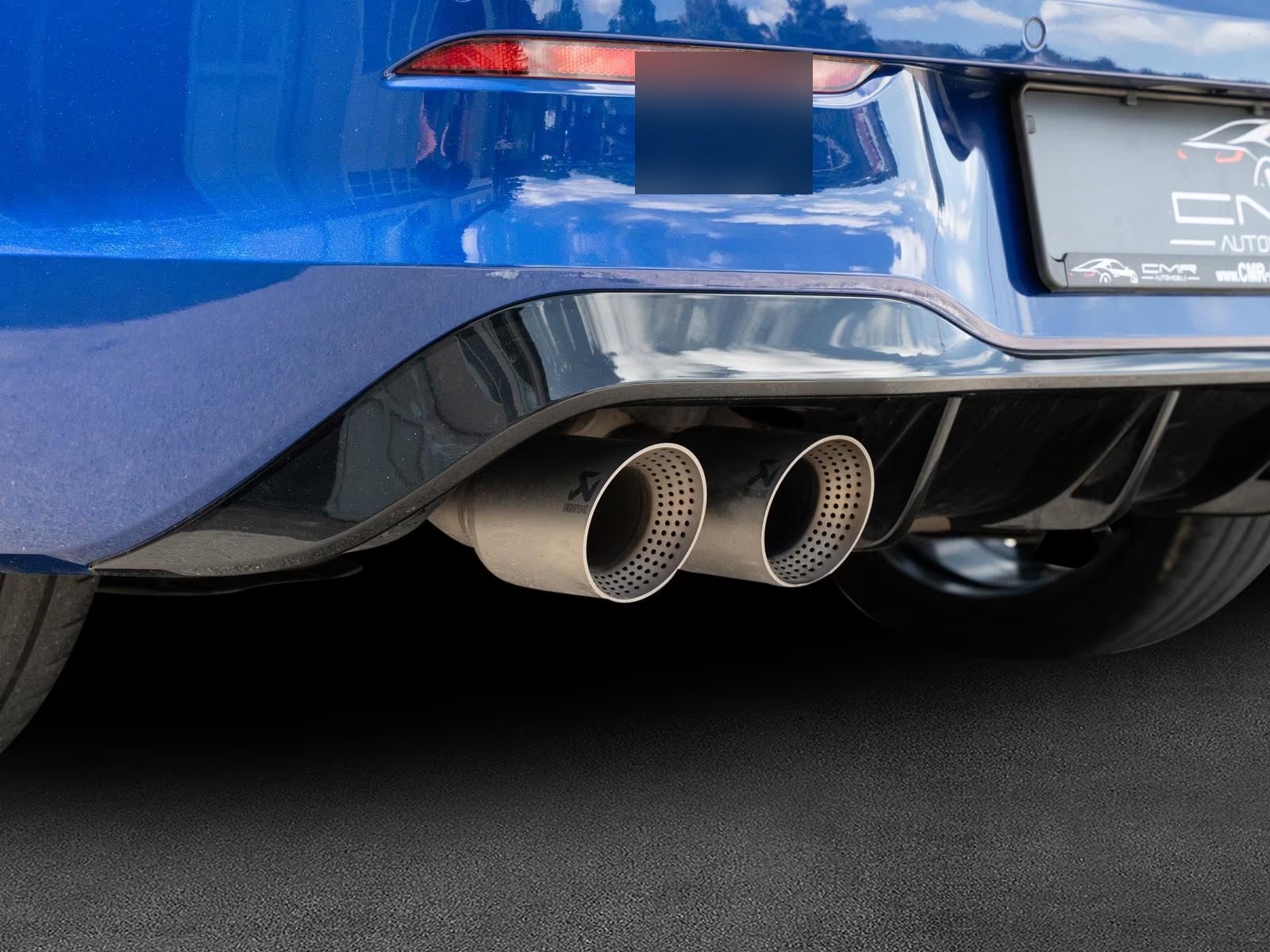 Close-up of the Golf R Performance exhaust's twin perforated outlets.
