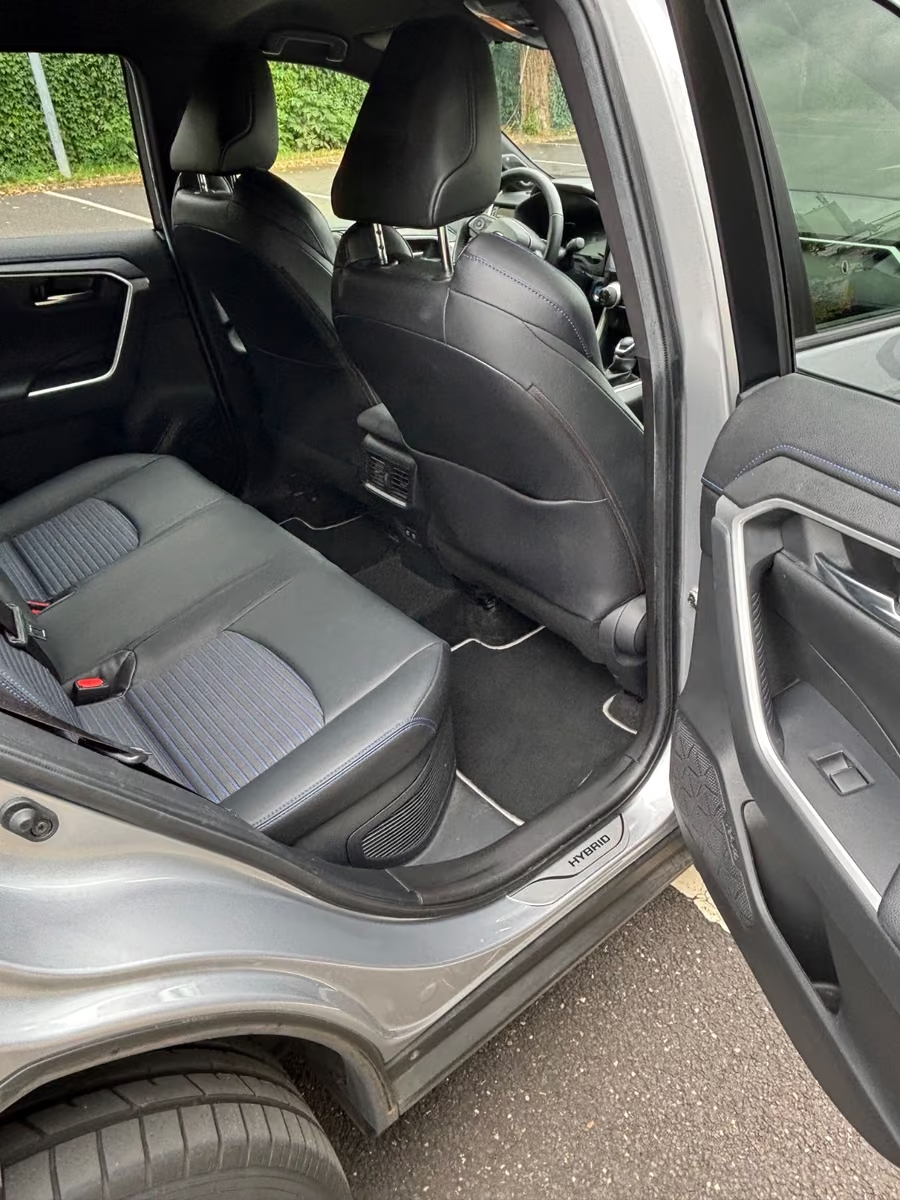 Rear black leatherette seats of the Toyota RAV4 Hybrid.