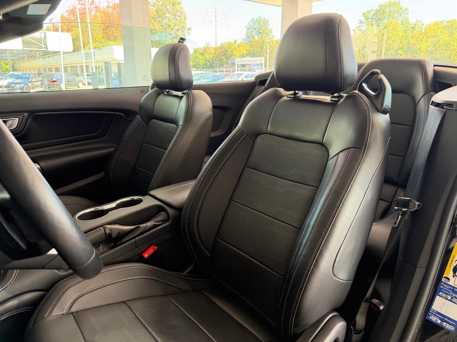 Black premium leather front seats in the Ford Mustang GT Convertible.