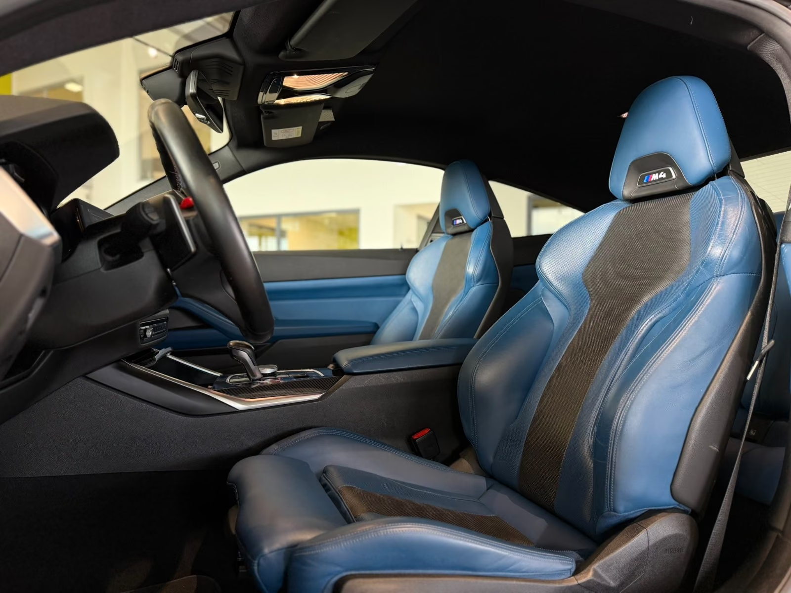 BMW M4 Competition — Fjord Blue and black Merino leather sport seats