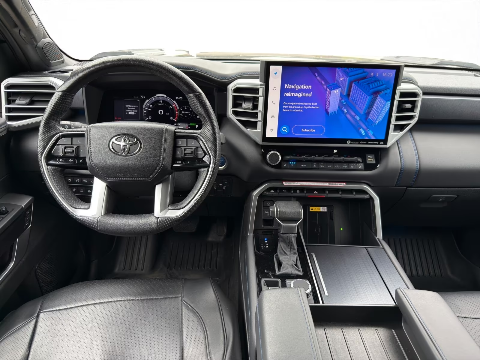 Toyota Tundra dashboard with 14-inch multimedia touchscreen and digital cluster.