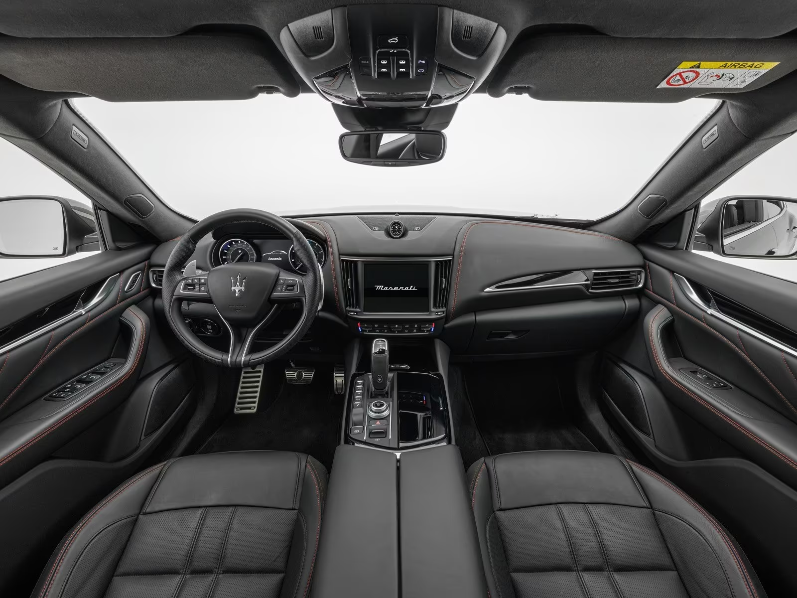 Maserati Levante dashboard with touchscreen, analogue clock and panoramic roof.
